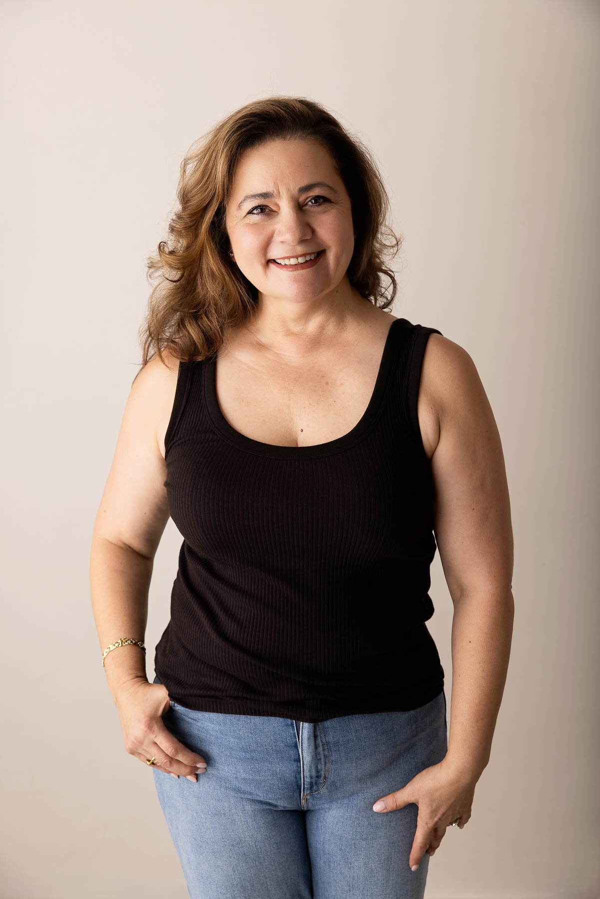 relaxed corporate headshot of a smiling woman