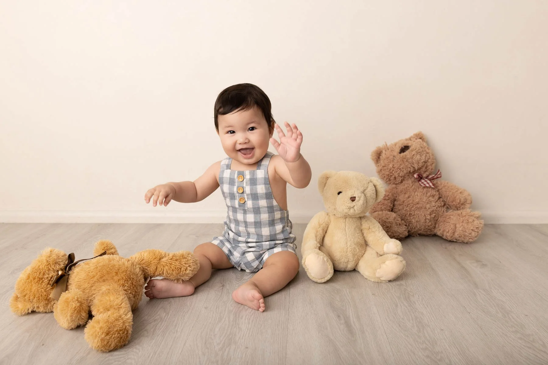 Baby photographer North Shore Sydney earth tones with bears and smiles