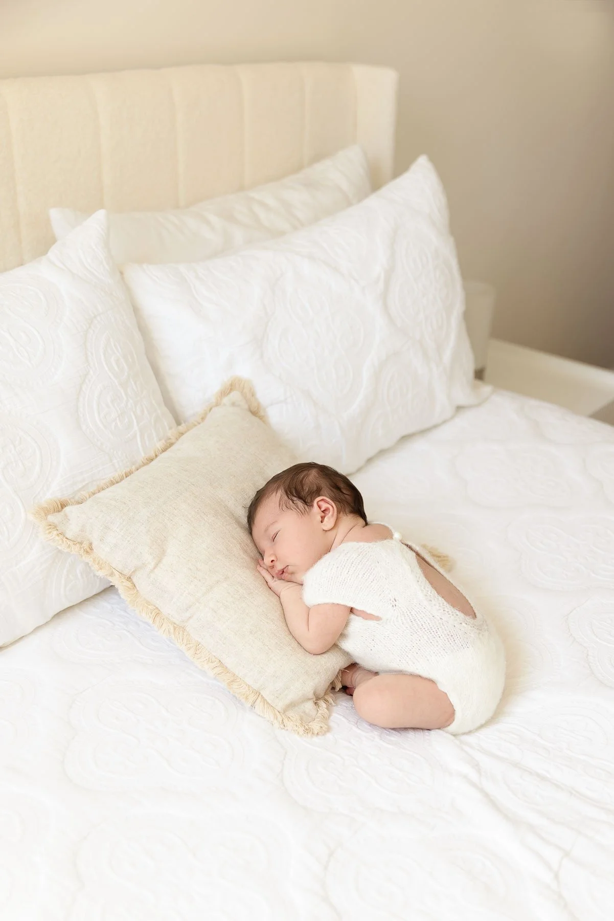 In home newborn and family sessions Sydney North Shore baby sleeping on a white bed