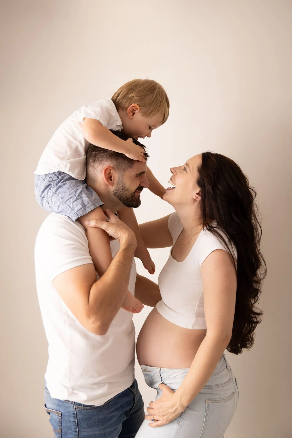 casual family maternity photography including toddlers in studio