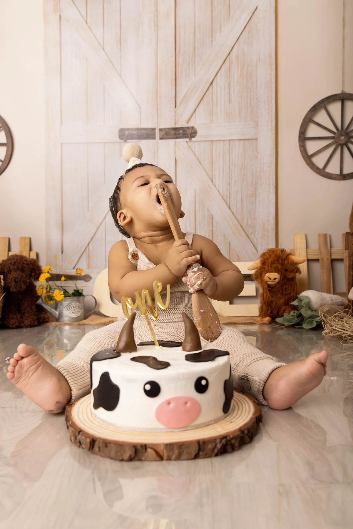 Cake smash photographer Sydney North Shore Farm theme baby licking a wooden spoon