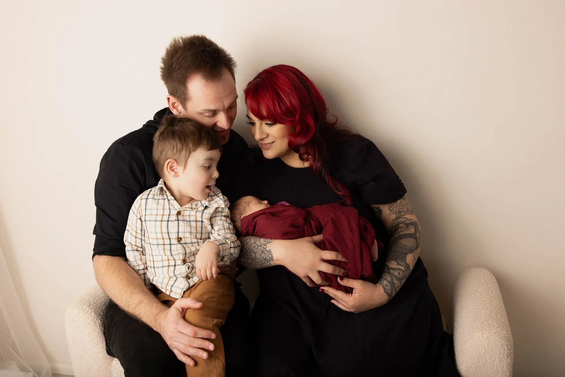 Newborn photographer North Shore
family picture with two kids all smiling