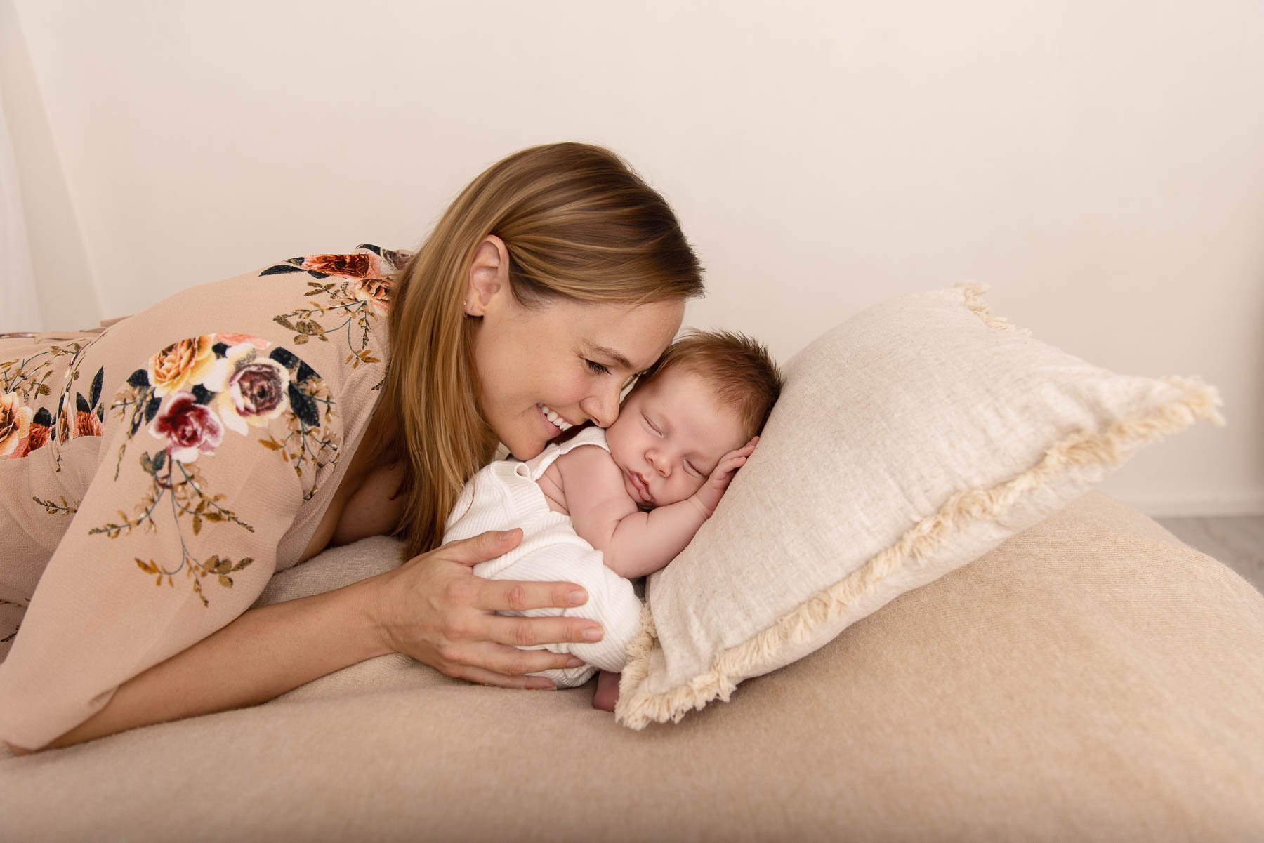 Relaxed newborn session, baby on his tummy his mother smiling at him, Noemie Vonthron Photography Newborn North Shore Photographer