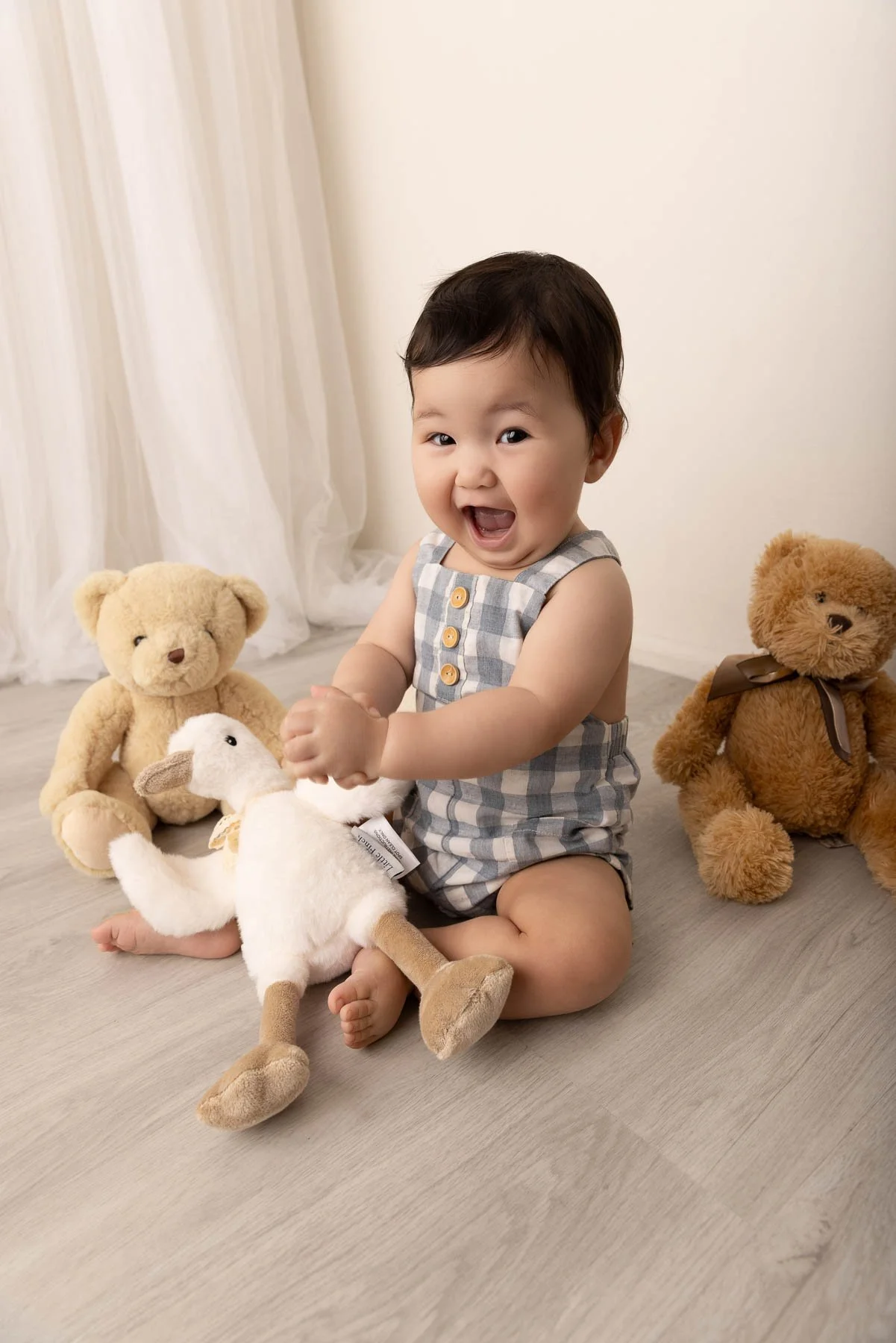 Baby photographer North Shore Sydney earth tones with bears and smiles