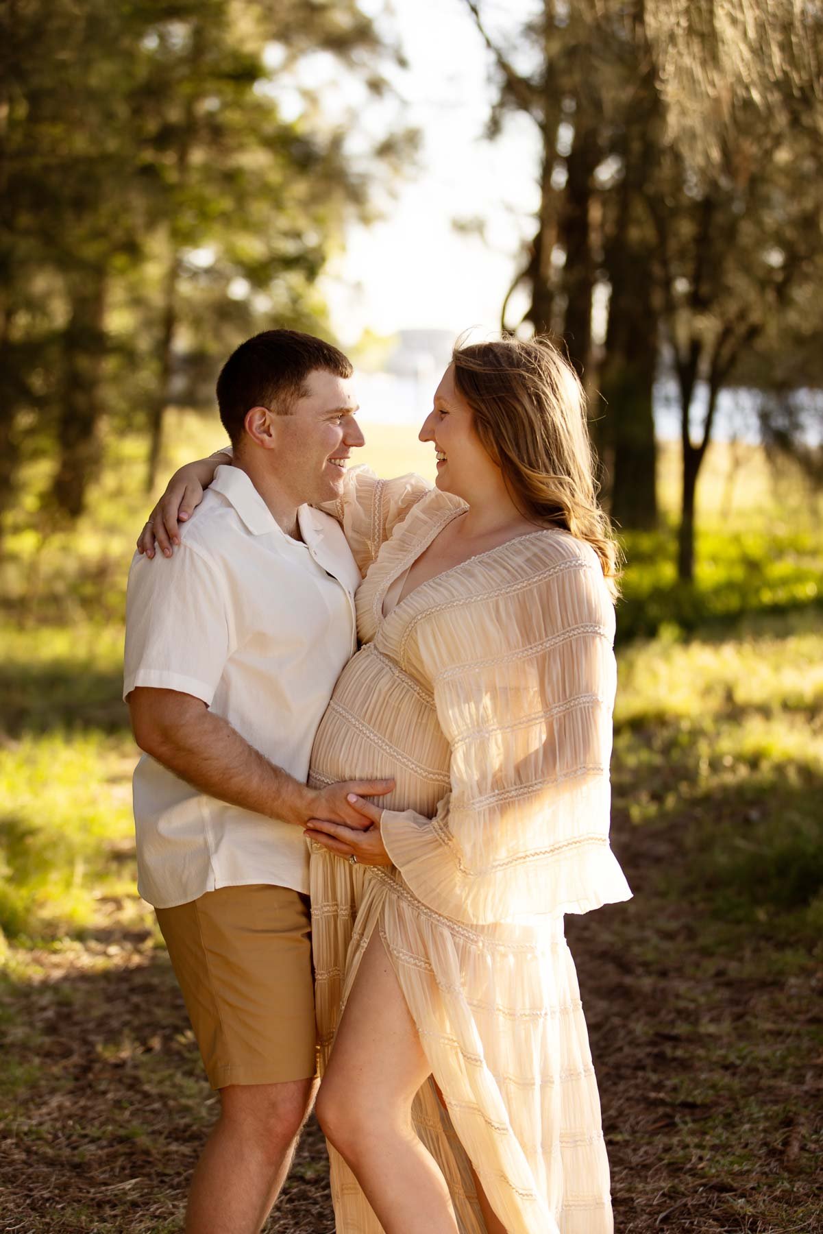North Shore Maternity photographer, couple with the lady pregnant