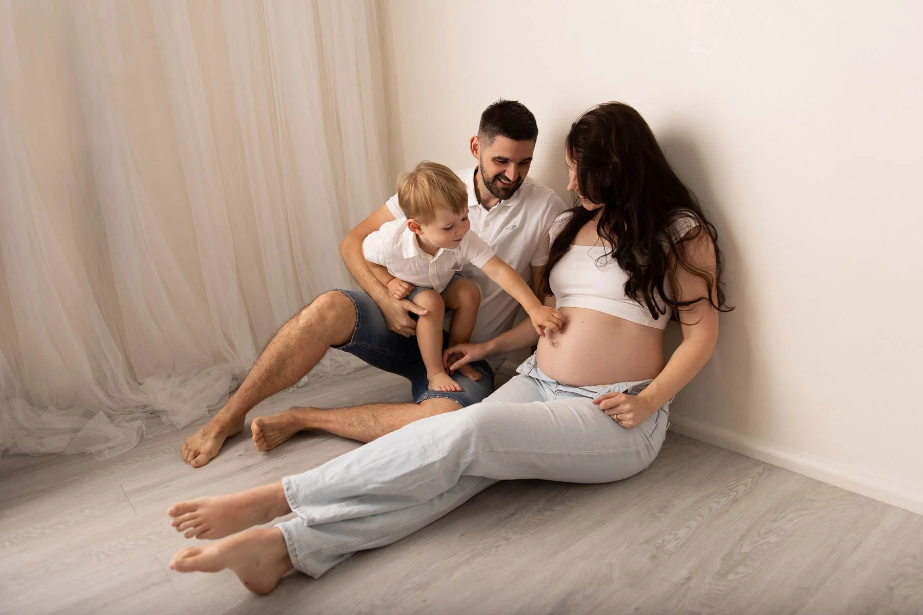 casual family maternity photography including toddlers in studio