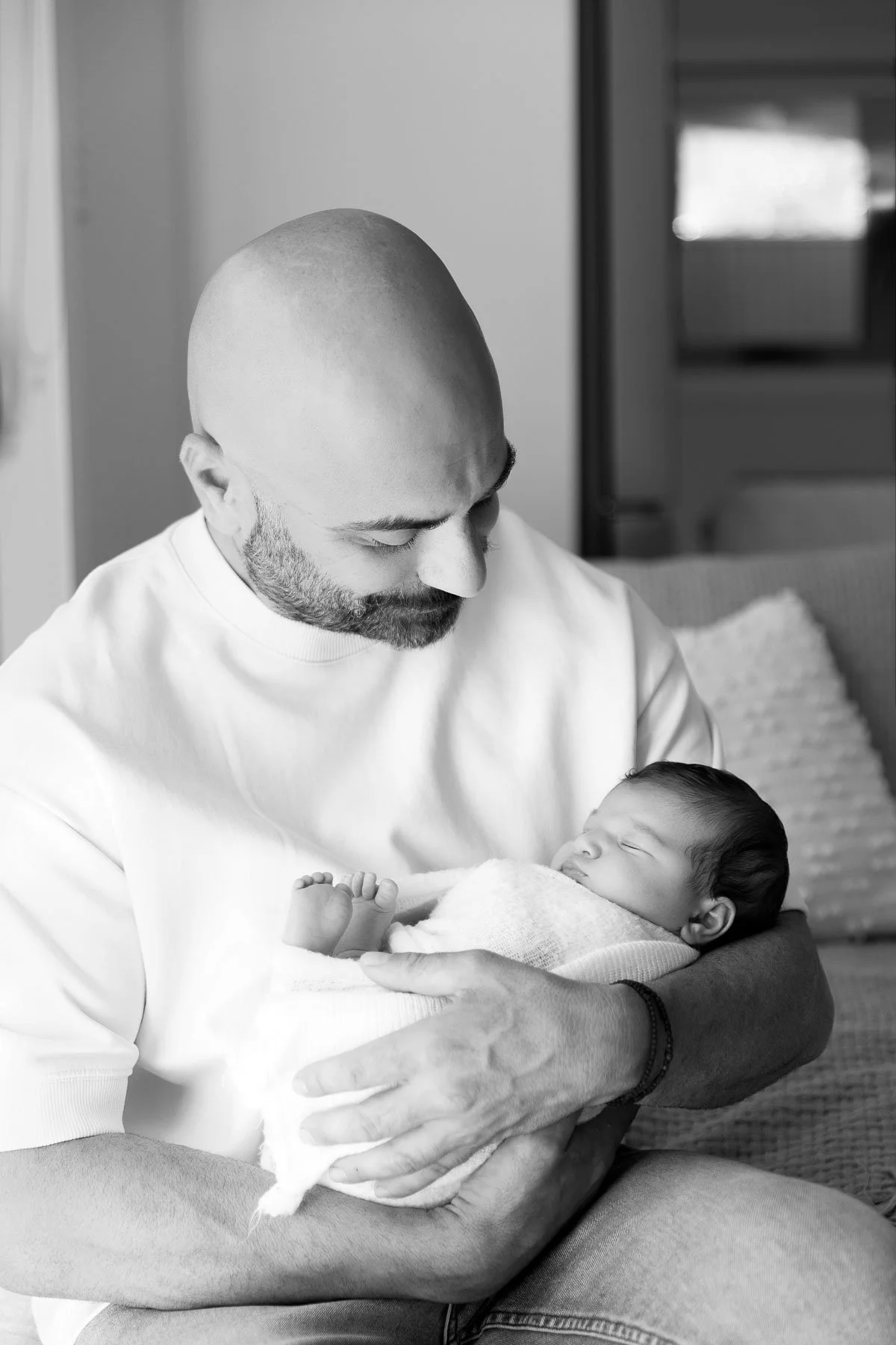 In home newborn and family sessions Sydney North Shore dad holding his baby