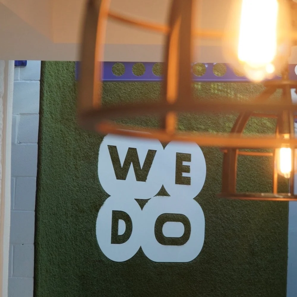 WeDo Work Spaces - Green Wall Logo Square.JPG