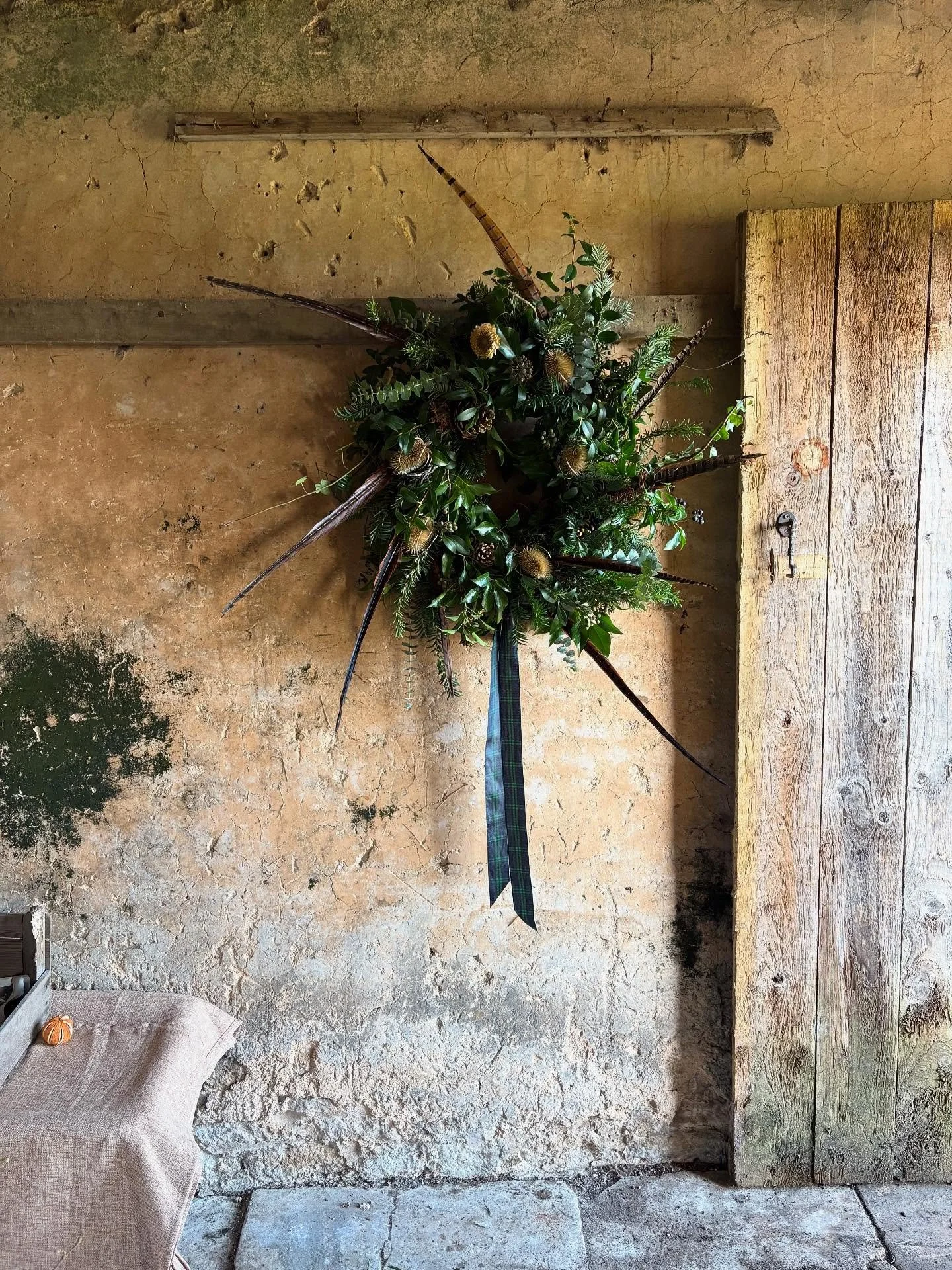 A bespoke, huge wreath for Alice and a tartan ribbon for her Scottish husband 💫 I really enjoy making one off wreaths with considered touches with special meanings, the process of talking, making, then handing over the finished piece, it&rsquo;s spe