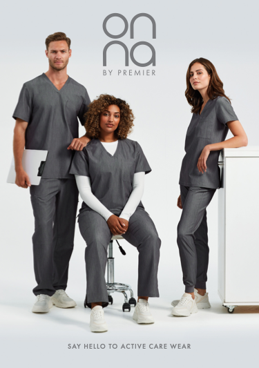 Three healthcare workers in gray scrubs, one sitting on an office chair, one standing to the left holding a tablet, and one leaning against a white counter to the right, with the text 'Onna by Premier' and 'Say Hello to Active Care Wear' in the background.
