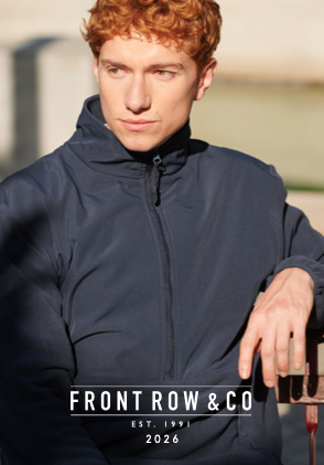 Young man with curly red hair wearing a navy blue jacket outdoors during daytime.