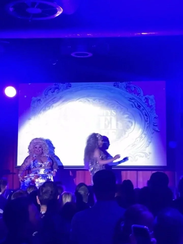 Today, we celebrate the life of Maxine Maurine Shield - a pillar of the Australian queer community, beloved around the world, who was as kind as her bosom was large.

LGBTQ+ grief and loss can hit differently.

The passing of Maxi Shield is being fel
