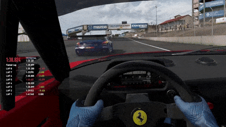 First-person view in a racing video game, displaying a car interior with a visible steering wheel featuring a Ferrari logo. A race track is ahead with a blue car being followed. Various race metrics are shown on the left side of the screen.