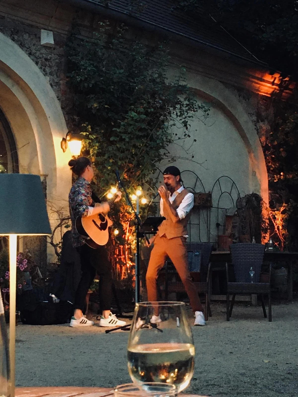 Two People standing outside and making music togehter