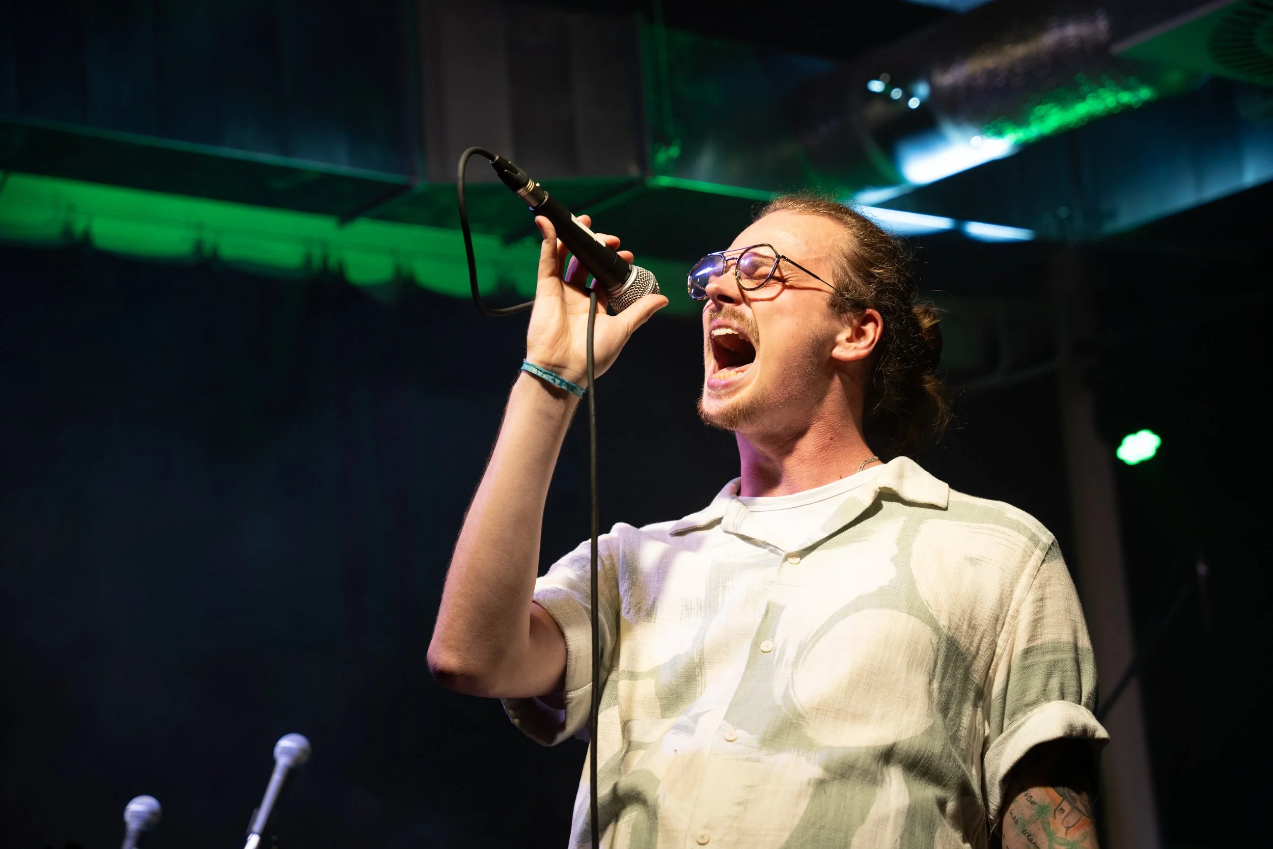 Singer with closed eyes sings powerful on Stage