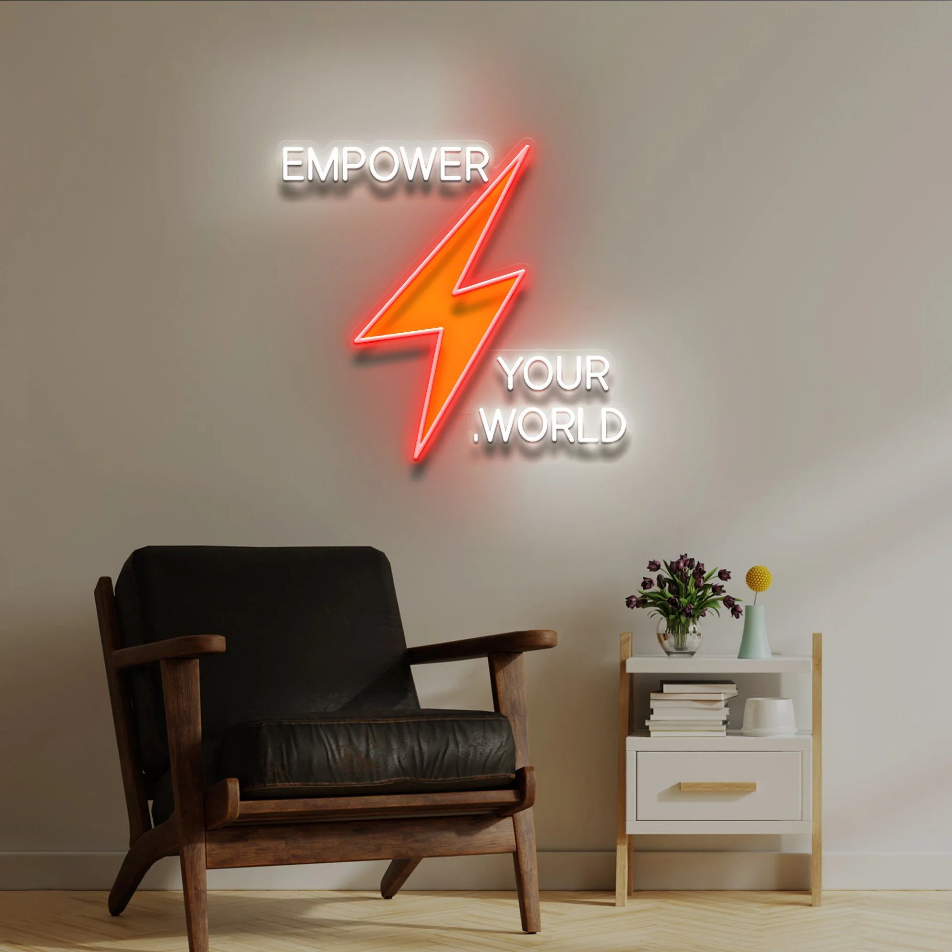 Living room corner featuring a wooden armchair, a white side table with books, a vase with flowers, a yellow decorative ball, and a neon sign on the wall reading 'EMPOWER YOUR WORLD' with a red lightning bolt.