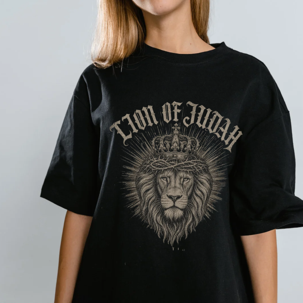 Woman wearing an oversized black Lion of Judah Christian t-shirt
