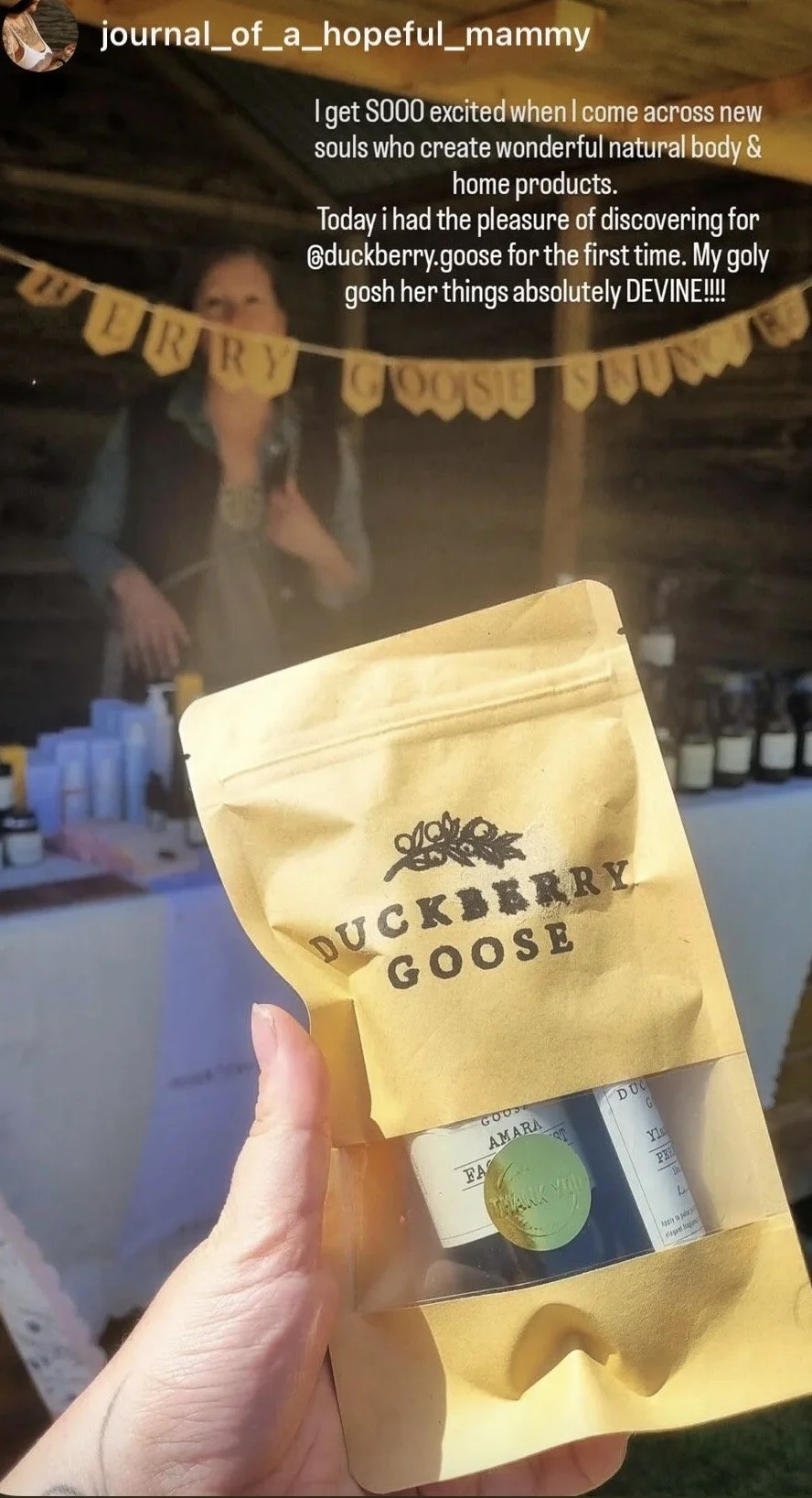 Paper ziplock bag with see-through window, with Duckberry Goose perfume oil and nail serum visible inside in eco-conscious amber glass packaging.