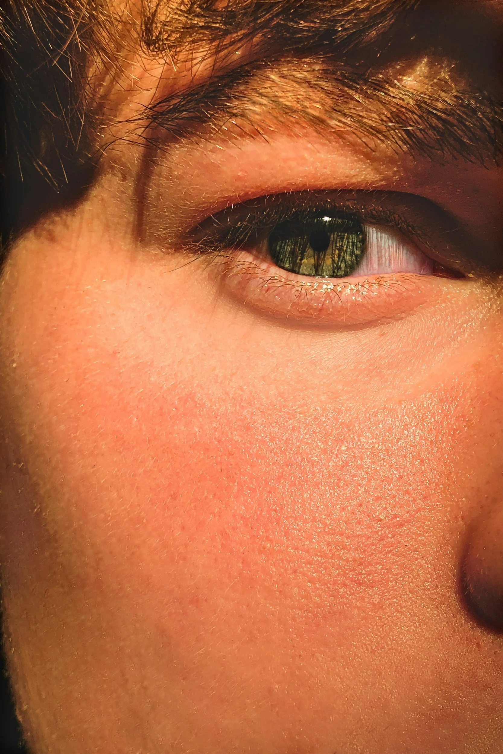 close-up of a young women's skin with sunscreen on