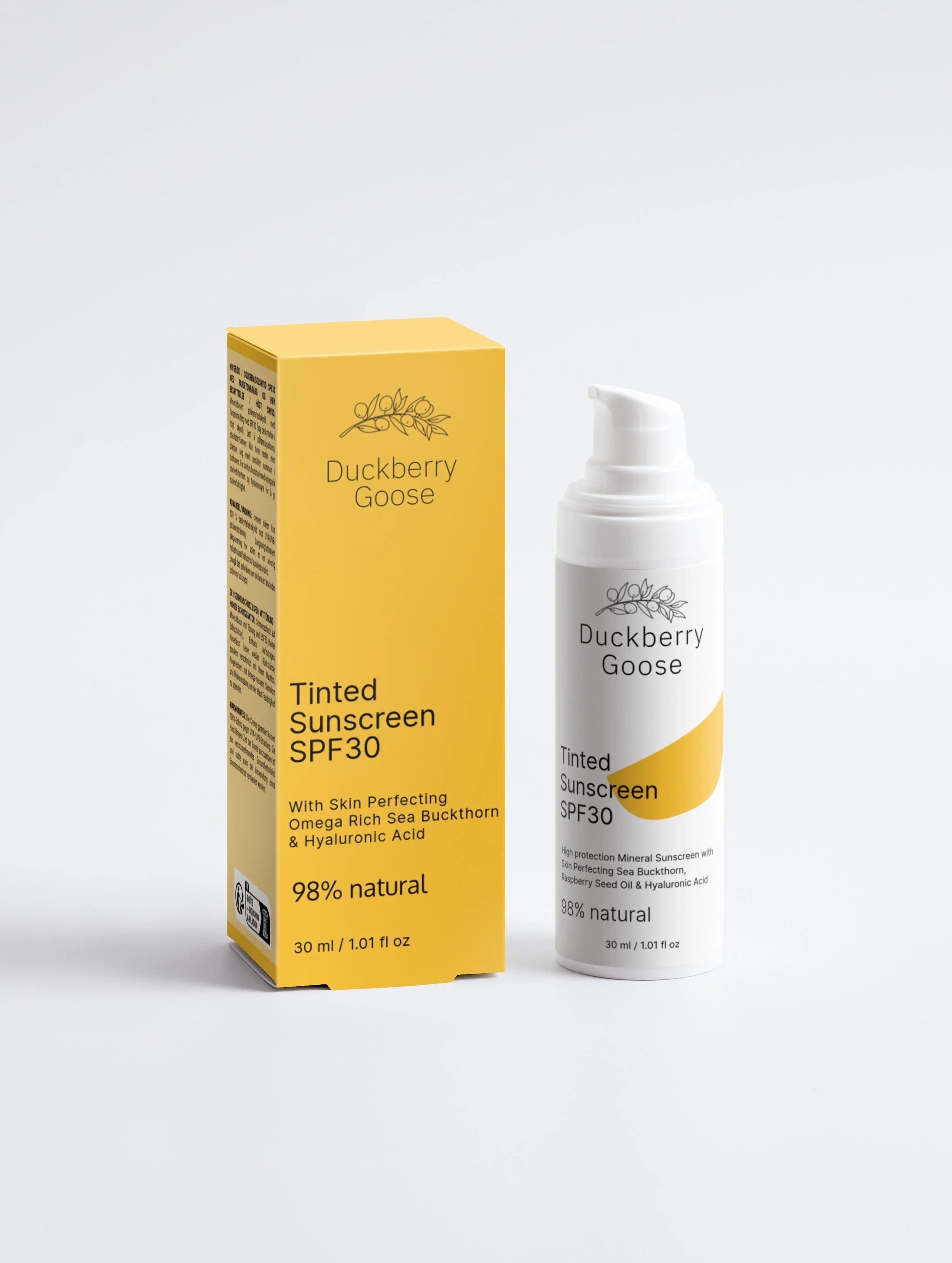 <img source='DBGTintedSS.jpg' alt='A yellow box and a white bottle of Duckberry Goose tinted SPF30 sunscreen, with the box on the left and the bottle on the right, against a plain white background.