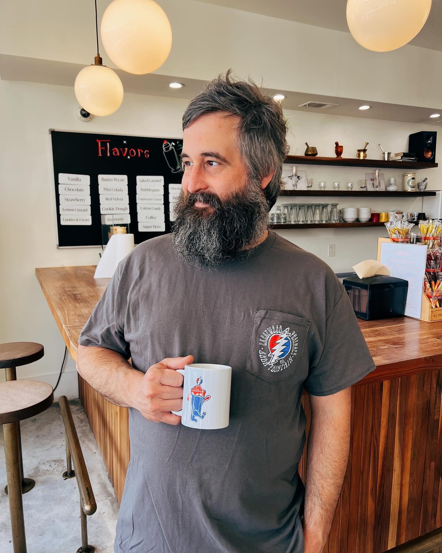 ‼️New Merch Alert‼️ We&rsquo;ve got some sweet new shirts and mugs in that are perfect for all of you dead heads out there 🔴🔵⚪️ They were designed by our talented soda jerk @jinx_and_powder (who is a freelance graphic designer here in bham if you&r