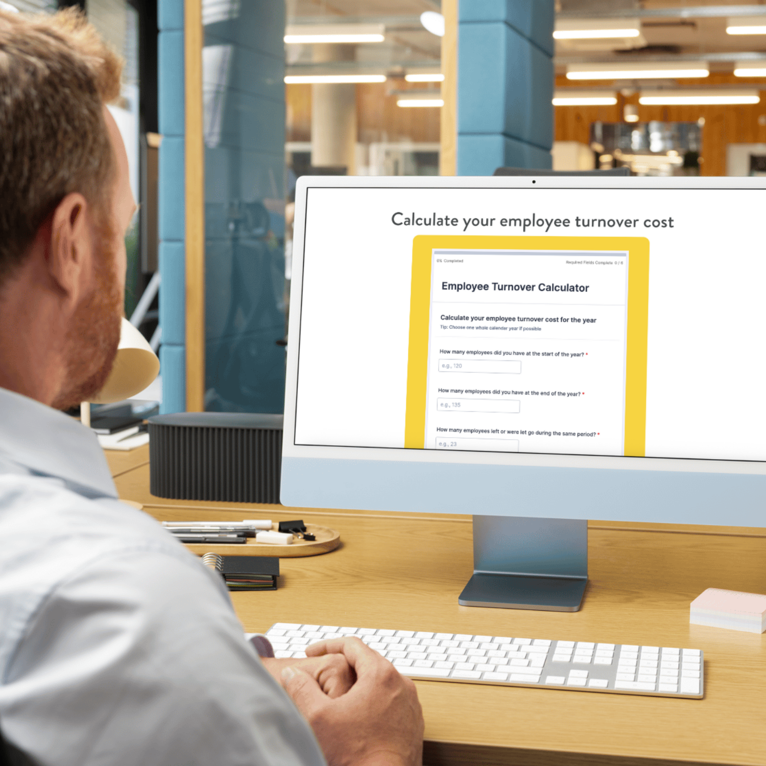man on computer looking at employee turnover calculator
