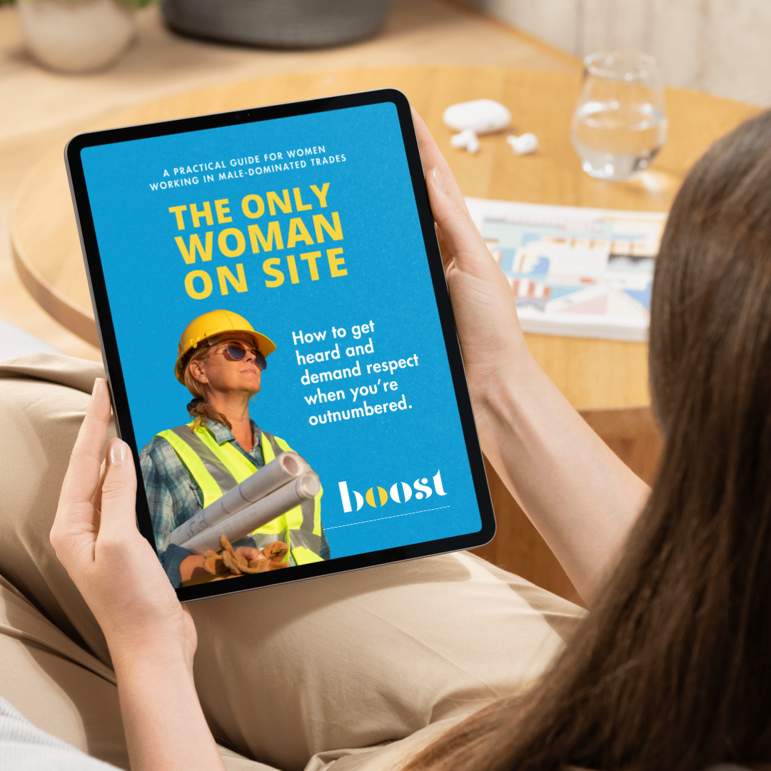 Tablet displaying a book cover titled 'The Only Woman on Site' with subtitle 'How to get heard and demand respect when you're outnumbered,' and an image of a woman in construction gear with sunglasses and a hard hat.