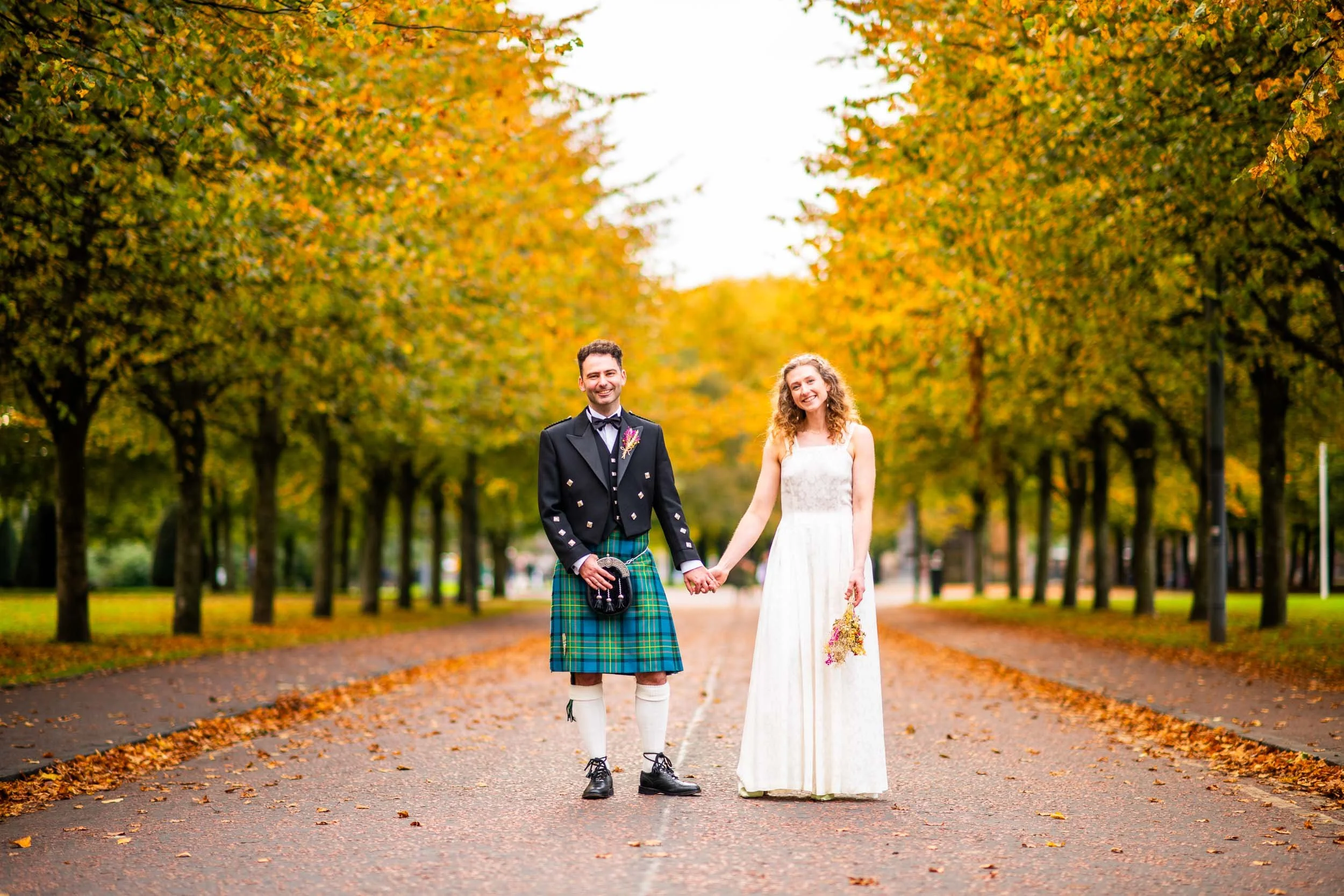 Autumn wedding photography at Glasgow Green with the newlyweds shortly after sealing their vow at West on the Green.
