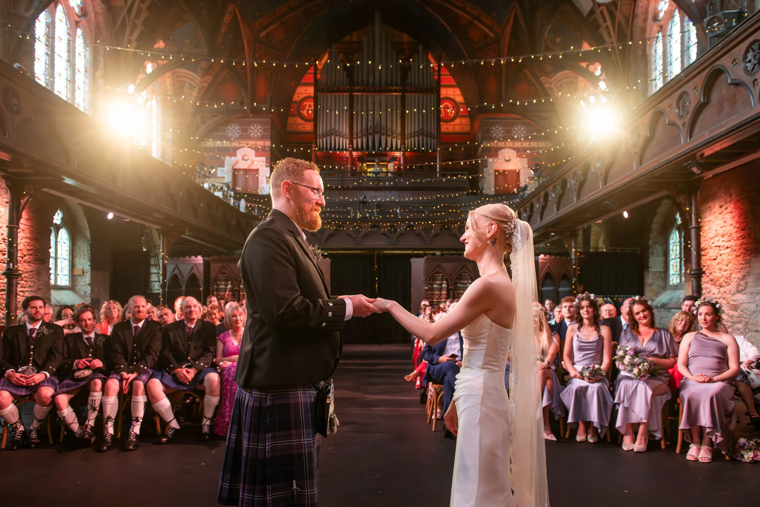 Glasgow wedding photography at Cottiers with the bride and groom exchanging rings.