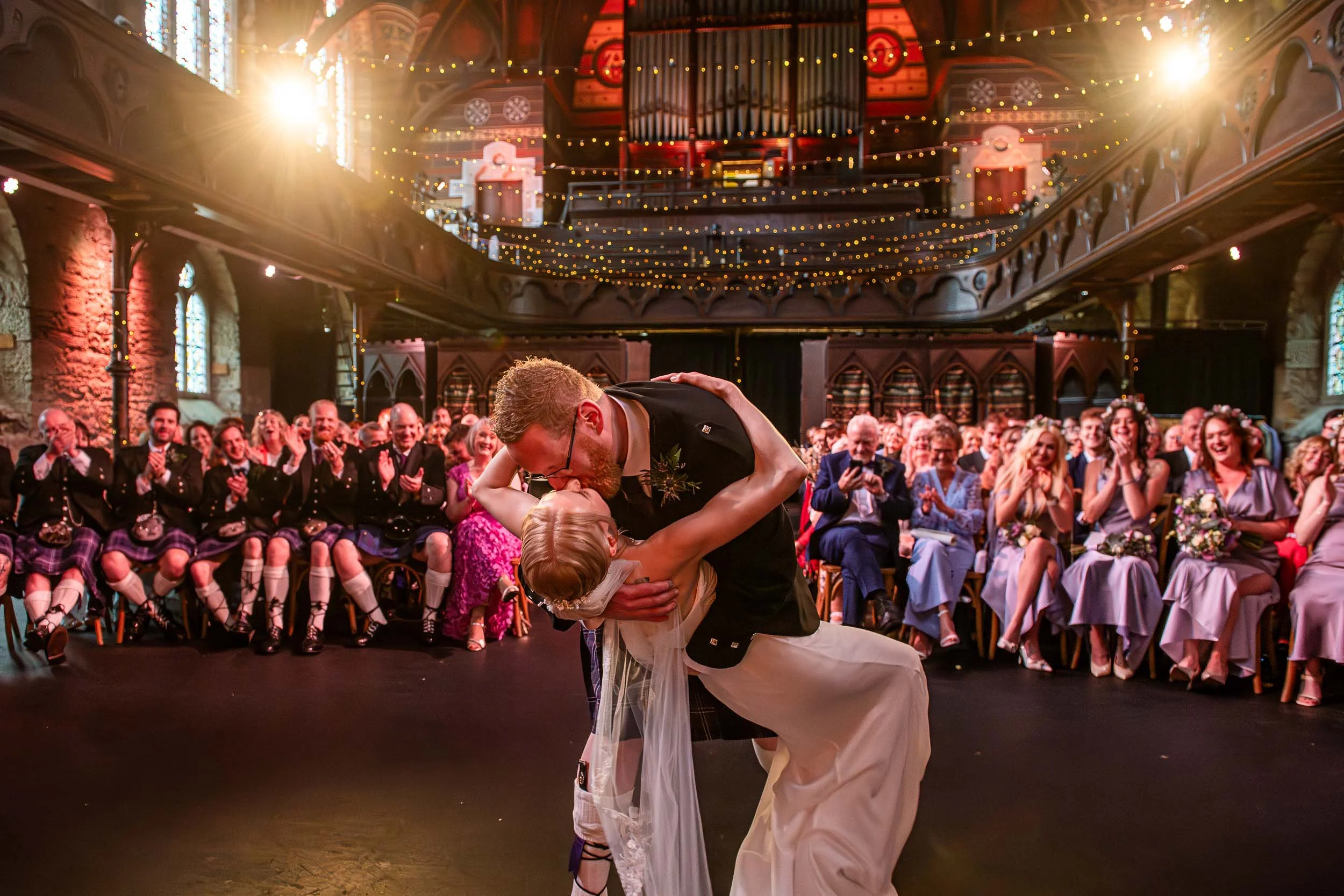 Sealing the vows with a kiss at Cottiers, Glasgow.