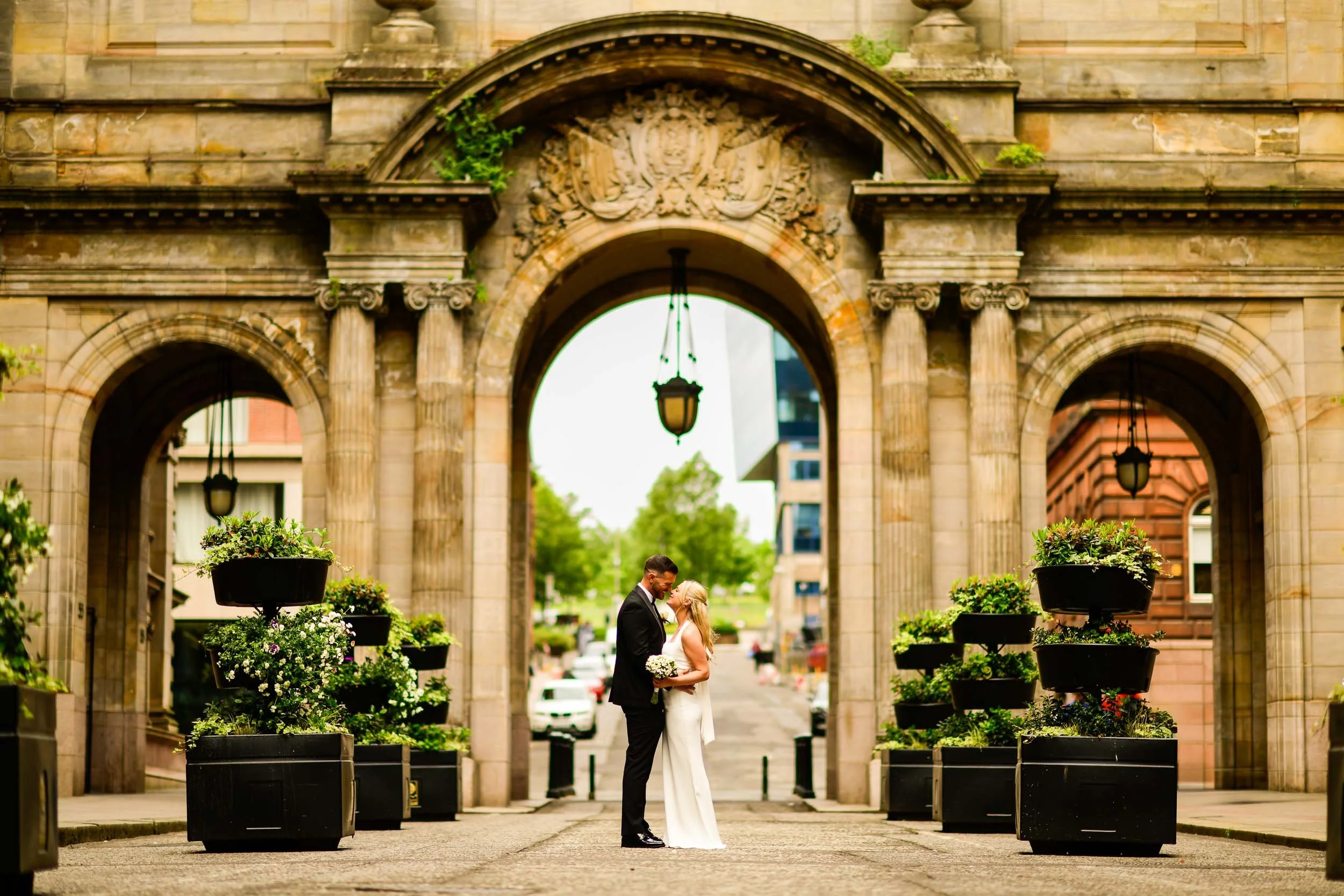The wedding couple in the grounds of the city chambers shortly after getting married round the corner at 23 Montrose Street.