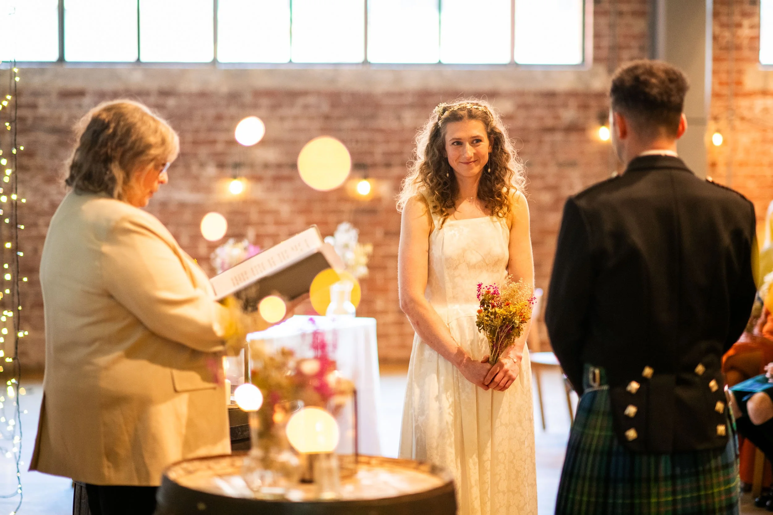 The Bride at West on The Green, Glasgow, gazing at her Groom during the service.