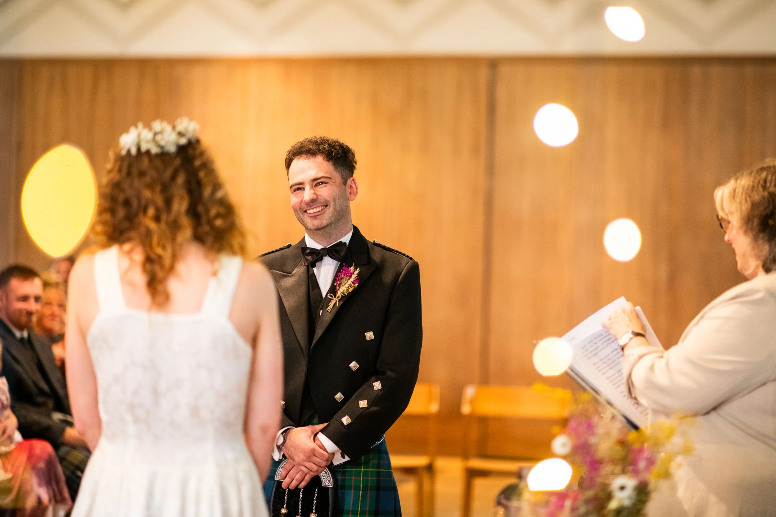 The Groom at West on The Green, Glasgow, gazing at his bride during the ceremony.