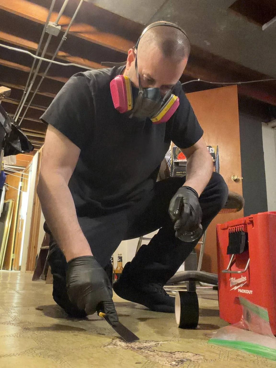 Illinois licensed asbestos inspector collecting a sample during an asbestos inspection in Chicago.