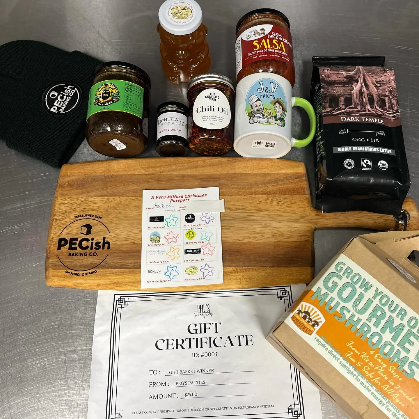WINNER #2 - Steve Brierley. Thank you for supporting all the participating businesses this past weekend at A Very Milford Christmas!
Your prize basket includes:
@pecishbaking.co touque and wood board
@lighthallvineyards red wine jelly
@pegspatties je