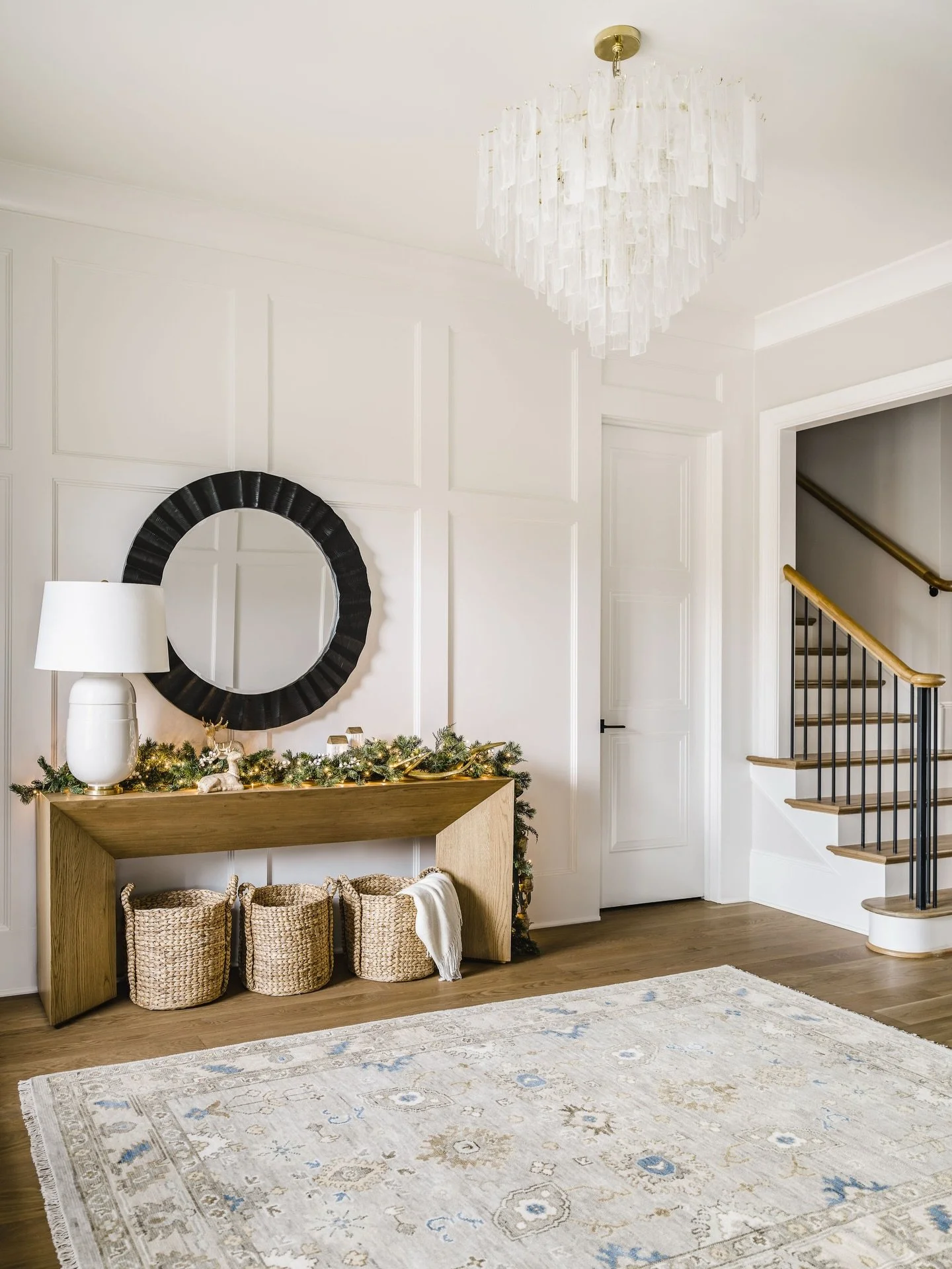 Layers of greenery, soft white lights, gold reindeer, and a few simple touches make an entryway feel special during the holiday season. 🤍✨

📷: @tiffanyringwald 
👷🏻&zwj;♂️: @arcadiahomesinc 

Charlotte Holiday Decorations | Transitional Holiday De