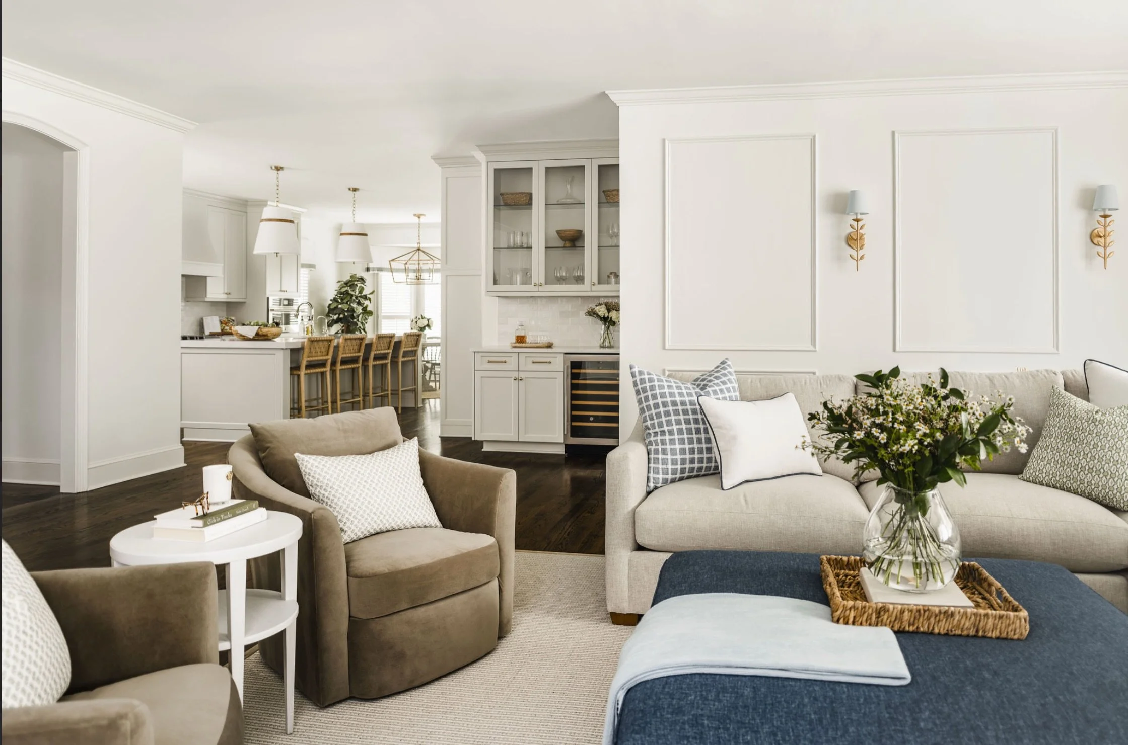 In an open-concept space, cohesion is key. 

From the color palette and patterns to the furniture and lighting, every detail should feel connected. We love choosing light fixtures that make a statement on their own while still complementing one anoth