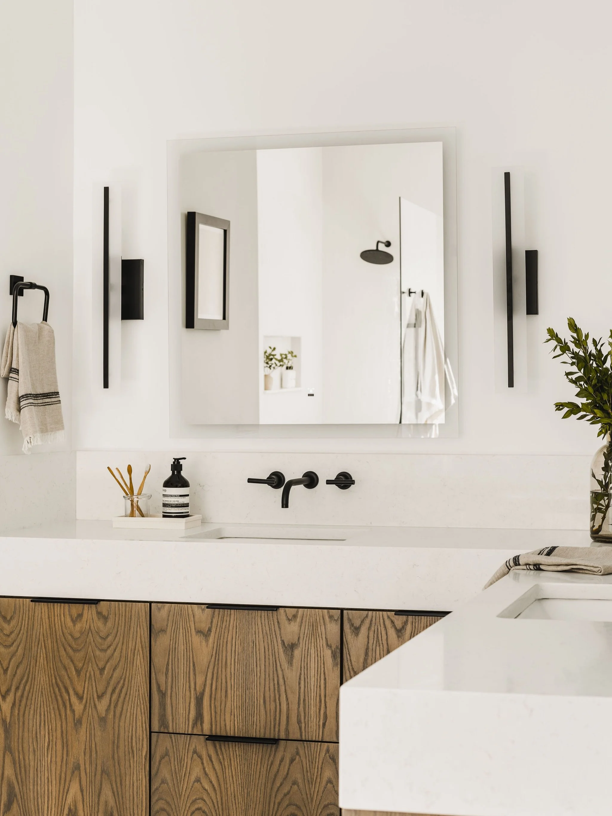 It&rsquo;s not every day we get to incorporate an extra-tall mitered-edge countertop into a design, and this primary bathroom was the perfect place for it.

This detail adds presence and refinement to the vanity, making it one of our favorite feature