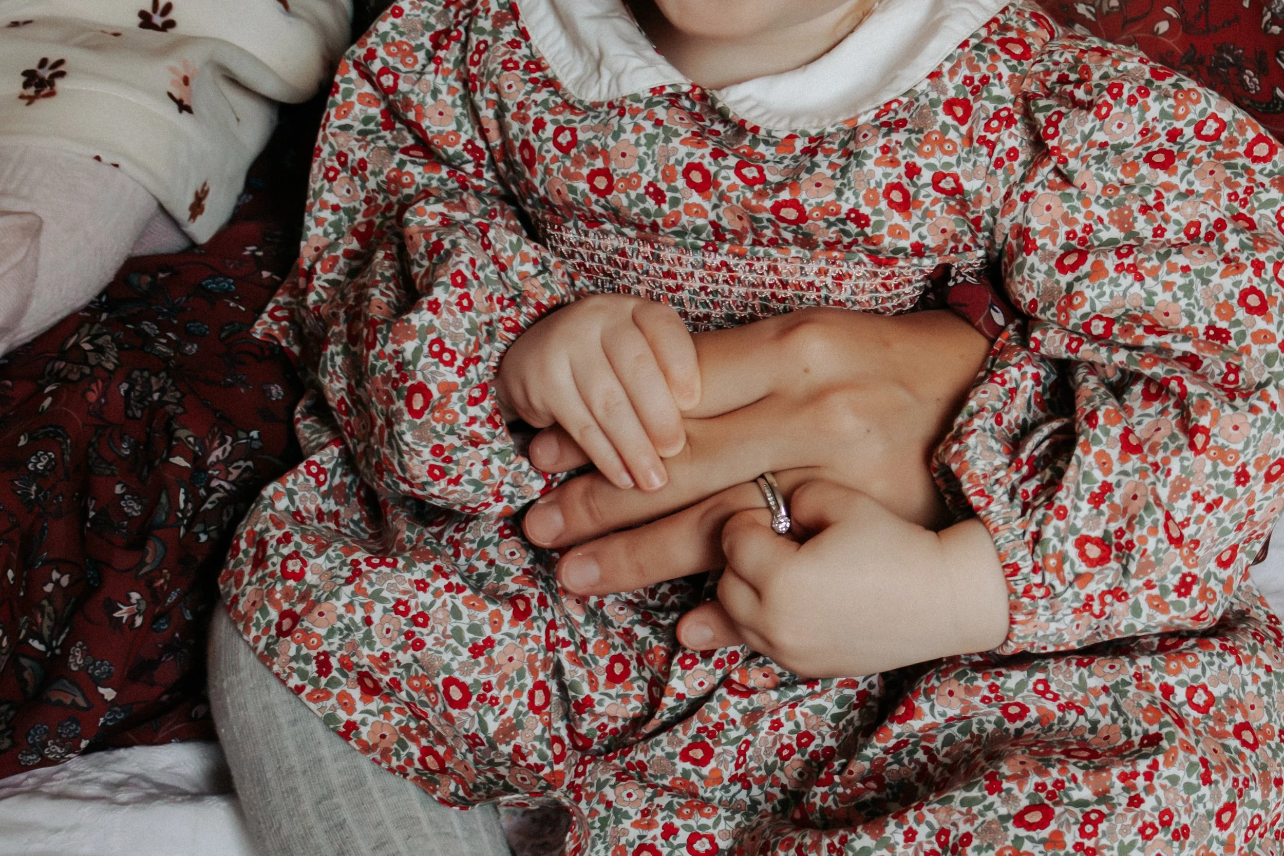 detail photo close up of mom and toddler hands Lifestyle newborn family photography in uxbridge ontario