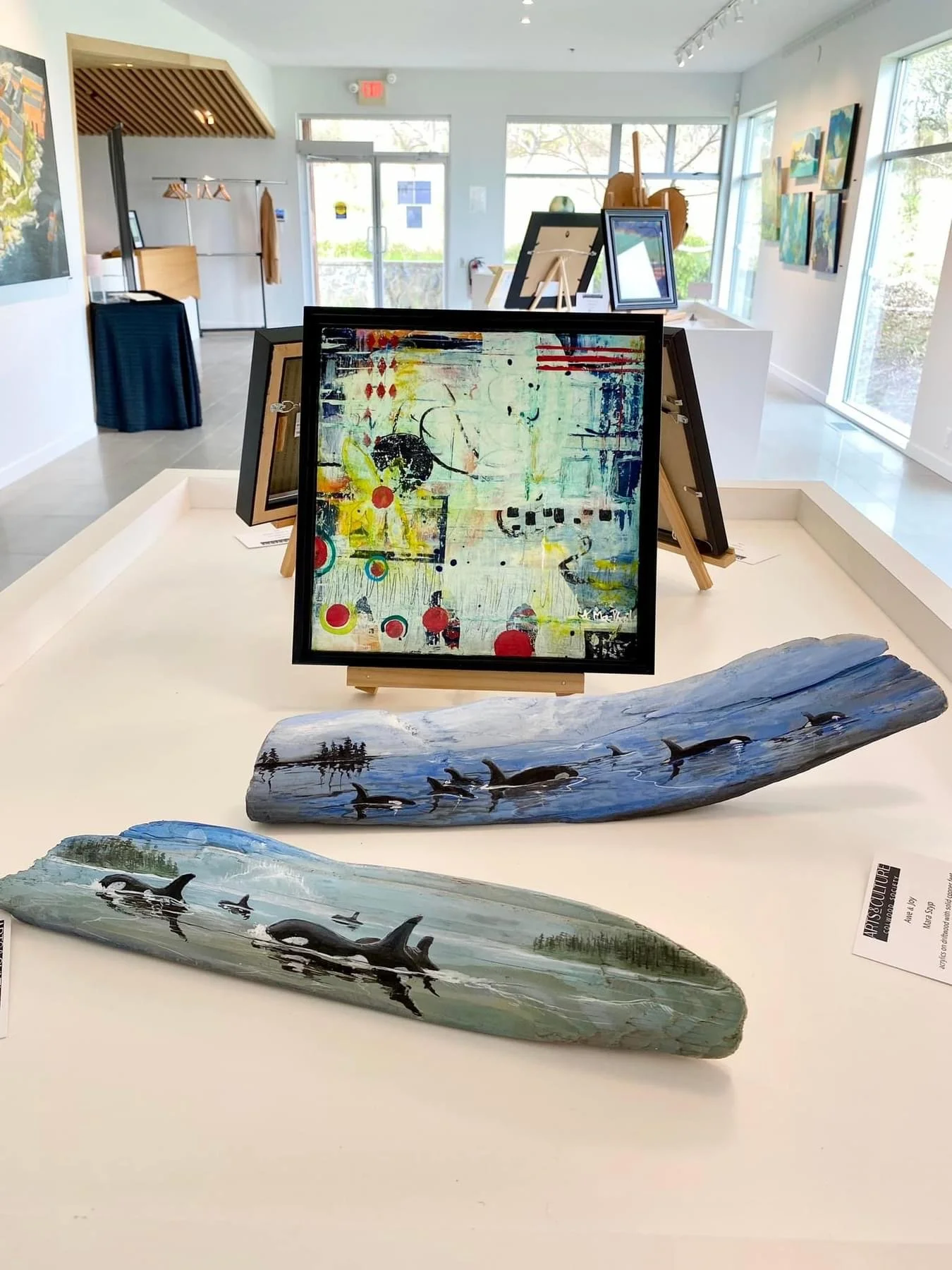 Photo from juried art exhibition organized and held at Golfinch Art Gallery, Arts and Culture Colwood group showcasing two exquisite driftwood original artworks hand-painted by Mara Szyp. Both sold.