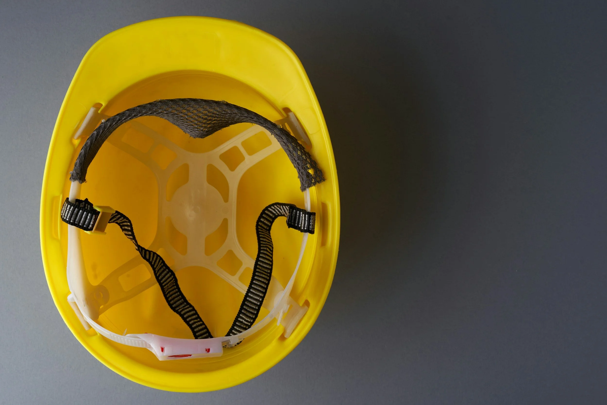 An upside-down yellow hard hat