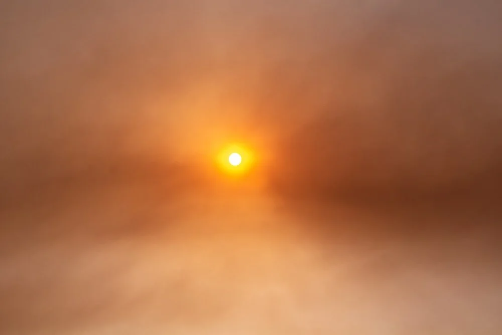 Smoky sky with sun in the center
