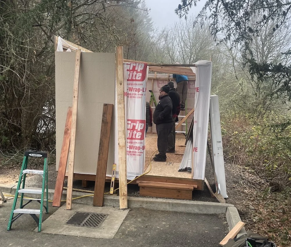 The volunteer crew working on the shed interior
