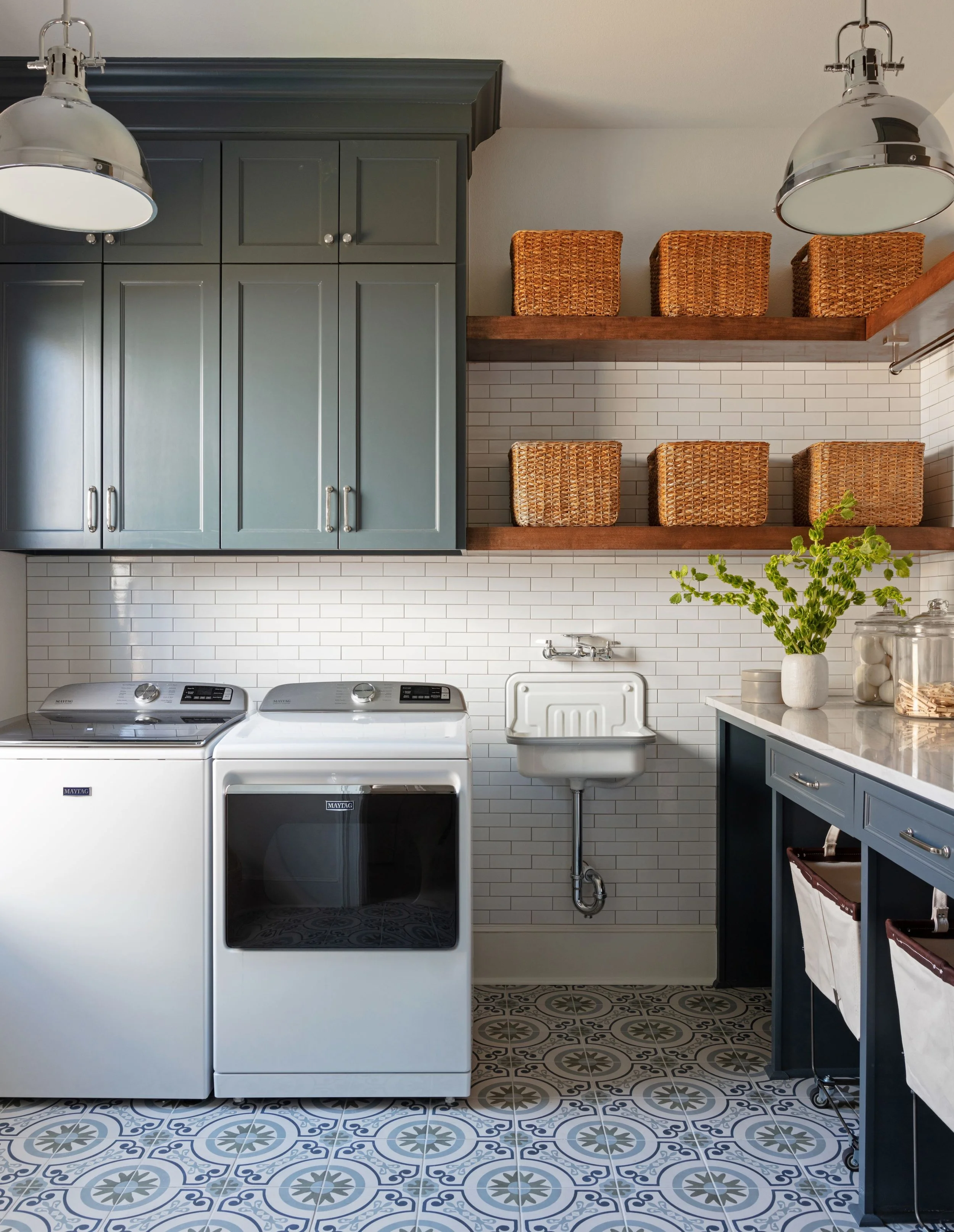 A mudroom and drop zone designed by Shine Interior Design Studio, showing built-in storage and durable materials.