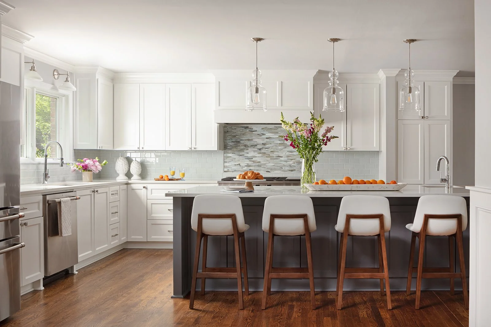 The Former Layout Had Limited Seating And Positioned The Cooktop Where It Interfered With People Seated At The Peninsula. Kitchen Remodel in Little Rock, AR by Shine Interior Design Studio |Luxury Interior Design Studio in Little Rock, Arkansas project photo