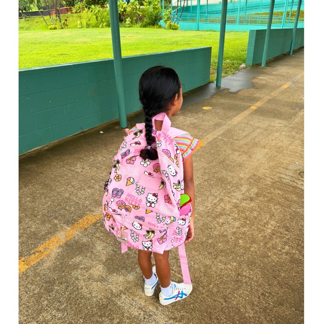 My daughter wearing her Hello Kitty backpack during kindergarten bootcamp at her school.