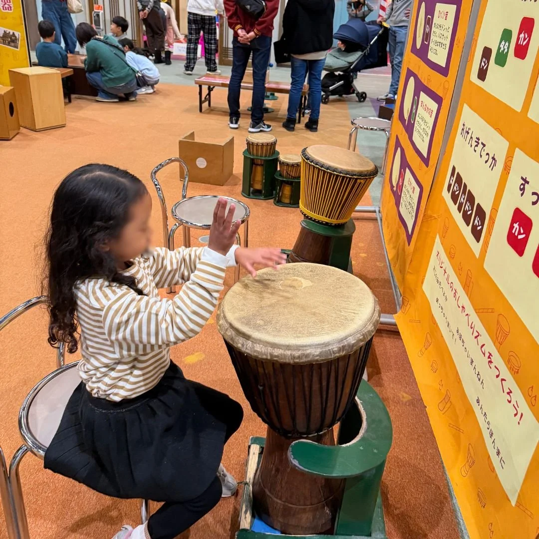 My daughter trying out an instrument