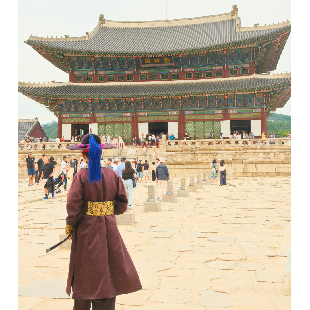 Gyeongbokgung Palace in Seoul with my husband wearing a traditional hanbok.