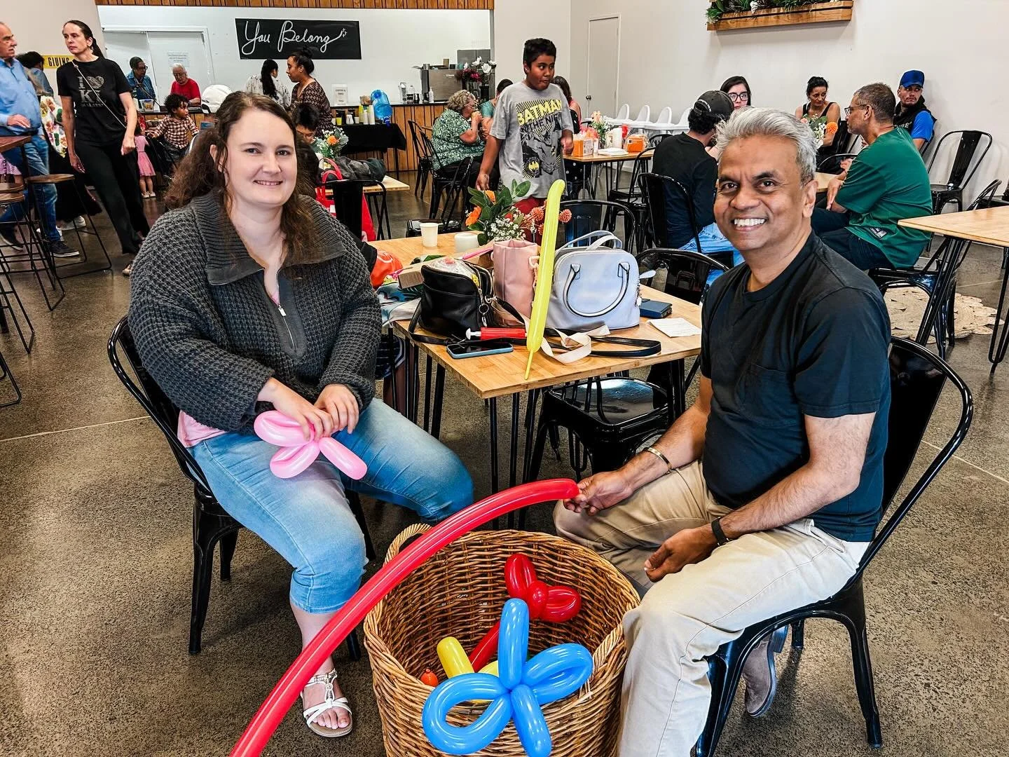 Every autumn, streets across West Auckland come alive with tables dragged outside, kids taking over the road, and neighbours sitting down together — that's Neighbours Aotearoa. 