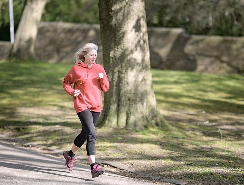 Older woman jogging